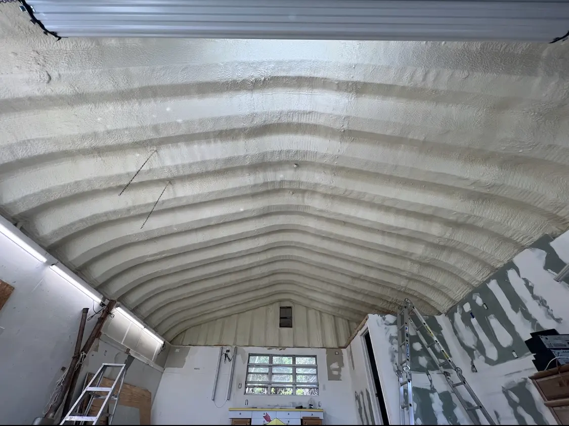 Spray polyurethane foam applied to the underside of a metal roof deck in South Beloit